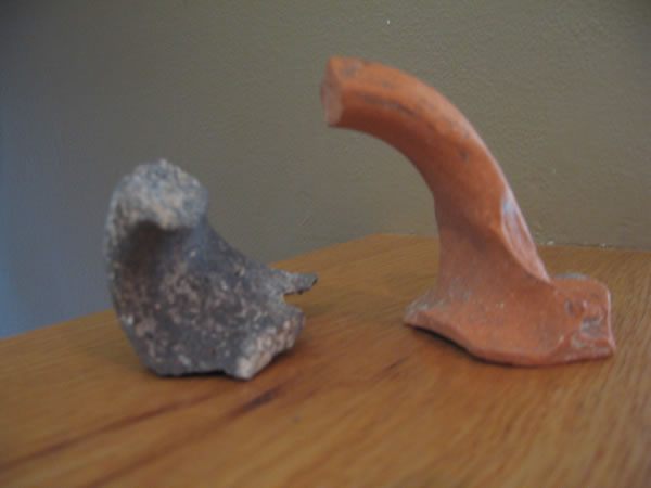 Handles from Beth Shan. The dark handle is from a basalt cooking utensil and shows a Jewish presence in the city. If a clay cooking pot became unclean it had to be smashed. But a stone pot, such as the dark handled piece, could simply be purified in water to be reused if it became unclean.